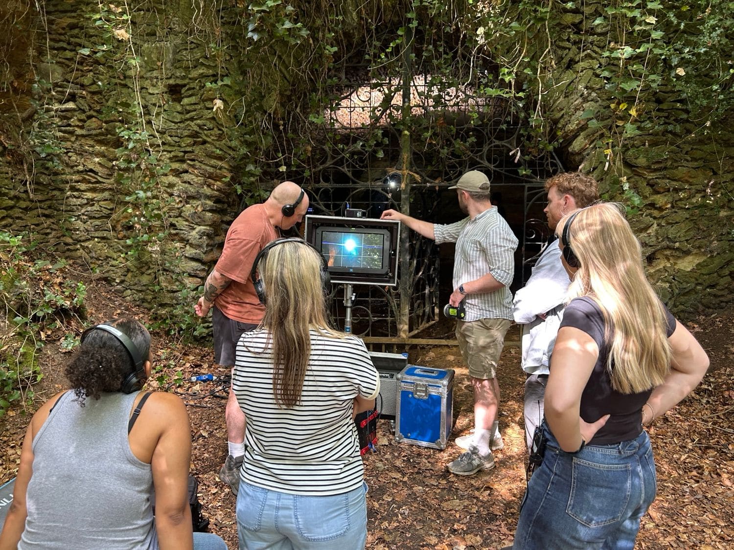 A professional film crew at the monitor outside the cave gates, Surrey