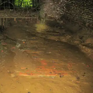 The original floor emerging from the sand