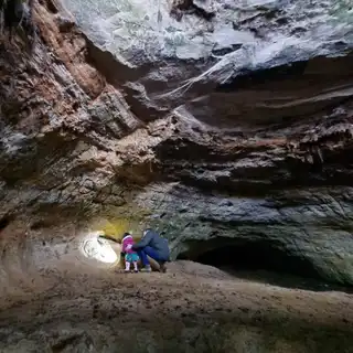 Exploring the main chamber, light falling on the sandstone